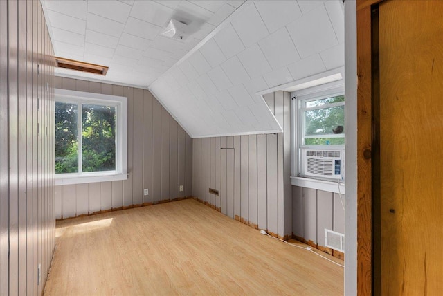950 Clark St, Hammond, WI 54015 - bonus room with plenty of natural light, wood finished floors, baseboards, vaulted ceiling, and cooling unit