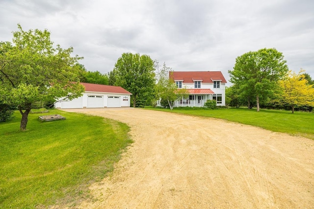E2221 930th Ave, Stanton Twp, WI 54725 - view of front of home with an outdoor structure, a front lawn, and driveway