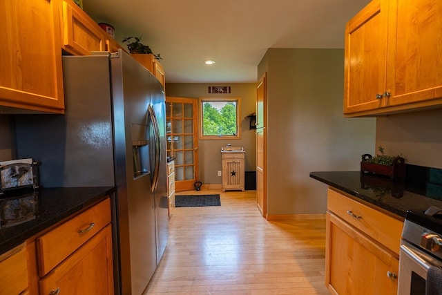 E2221 930th Ave, Stanton Twp, WI 54725 - kitchen featuring stainless steel appliances, light wood-style flooring, baseboards, recessed lighting, and dark stone countertops