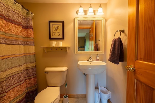 E2221 930th Ave, Stanton Twp, WI 54725 - full bathroom featuring toilet and baseboards