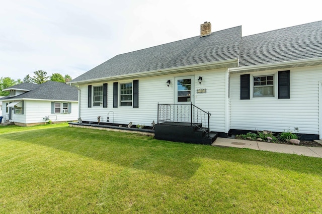 727 Peck St, Fergus Falls, MN 56537 - view of front of home featuring a front yard, a chimney, and roof with shingles