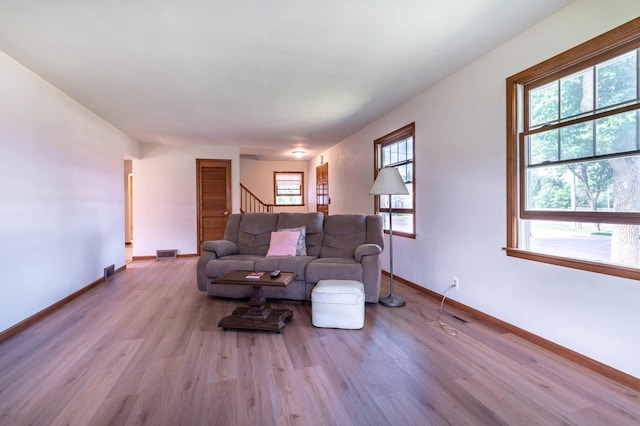727 Peck St, Fergus Falls, MN 56537 - living area with wood finished floors and stairway
