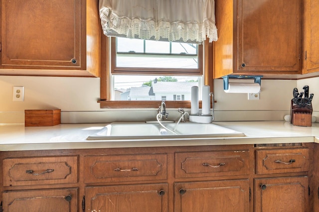727 Peck St, Fergus Falls, MN 56537 - kitchen with brown cabinets and light countertops