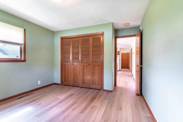 727 Peck St, Fergus Falls, MN 56537 - unfurnished bedroom with light wood-style floors and a closet