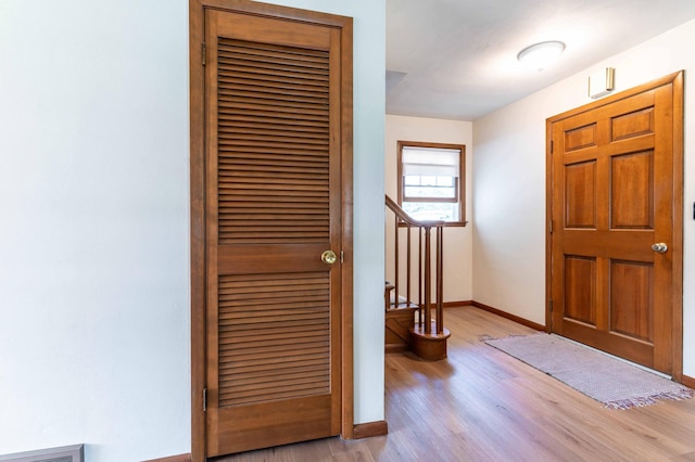 727 Peck St, Fergus Falls, MN 56537 - entrance foyer with light wood-style flooring and stairway
