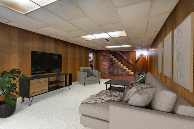 727 Peck St, Fergus Falls, MN 56537 - carpeted living area with wood walls and stairs