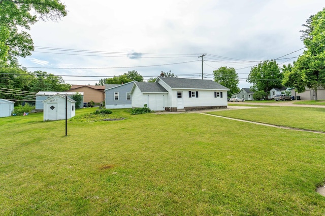 727 Peck St, Fergus Falls, MN 56537 - ranch-style house featuring a storage unit and a front lawn