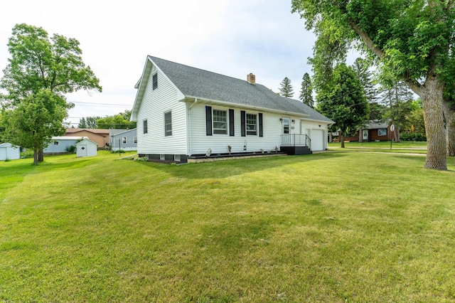 727 Peck St, Fergus Falls, MN 56537 - view of front of house featuring a shed, a chimney, a front yard, and a garage