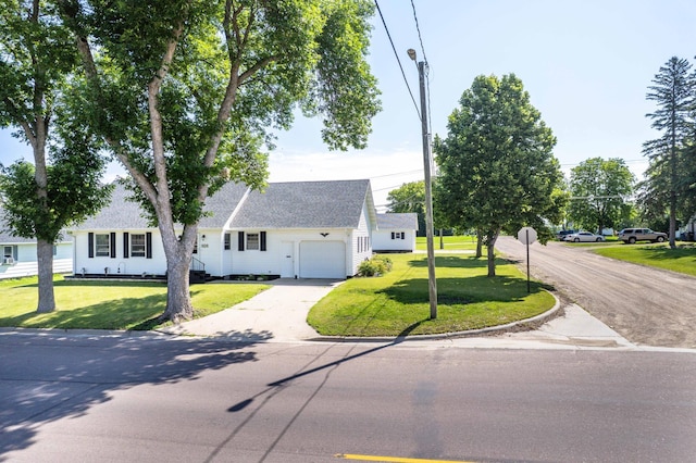 727 Peck St, Fergus Falls, MN 56537 - view of front of house with an attached garage, driveway, a front yard, and roof with shingles