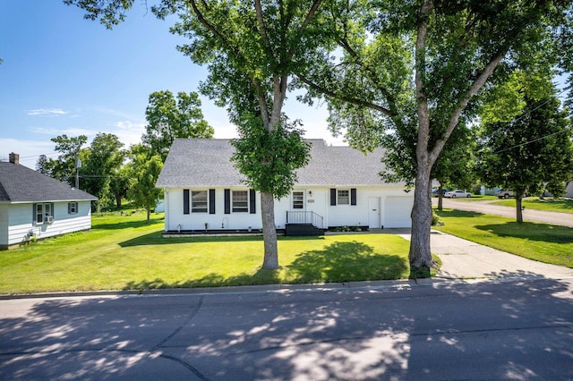 727 Peck St, Fergus Falls, MN 56537 - view of front facade featuring driveway, an attached garage, a front yard, and roof with shingles