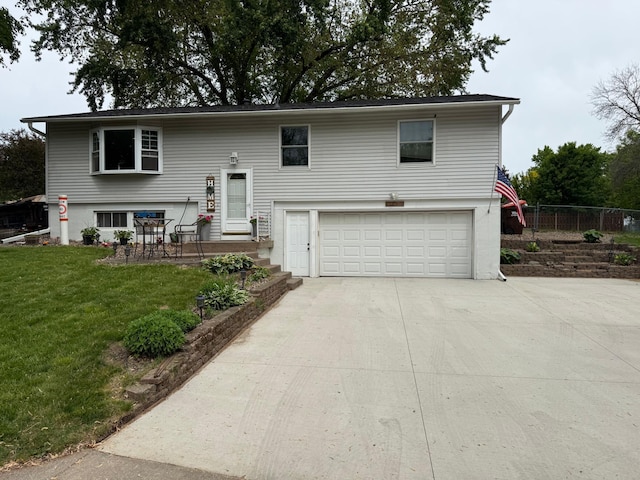 14496 55th St N, Oak Park Heights, MN 55082 - bi-level home featuring an attached garage and driveway