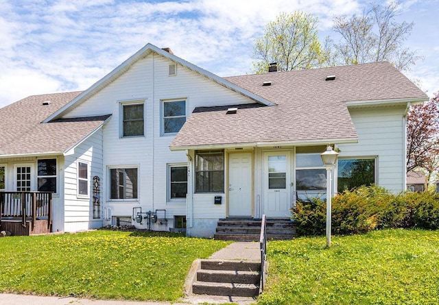 1040 86th Ave W, Duluth, MN 55808 - view of front facade featuring a front yard, a shingled roof, and entry steps