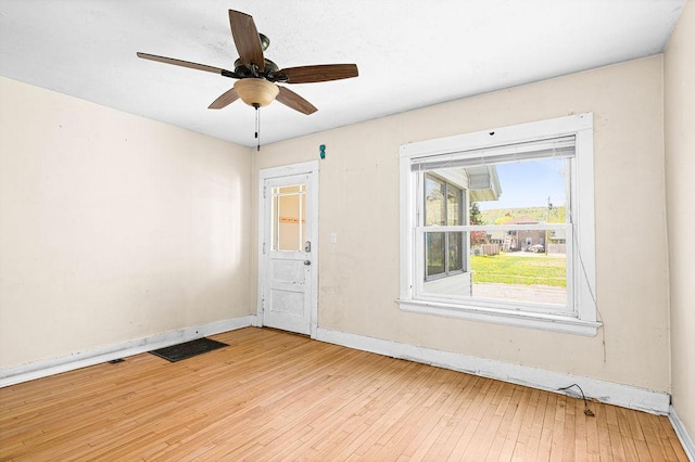 1040 86th Ave W, Duluth, MN 55808 - spare room featuring baseboards, light wood-type flooring, and ceiling fan