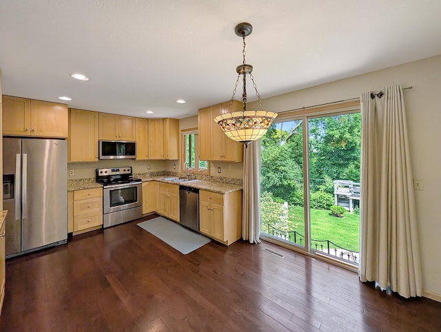 15142 75th Ave N, Maple Grove, MN 55311 - kitchen featuring stainless steel appliances, a sink, light brown cabinets, dark wood-style floors, and light stone countertops