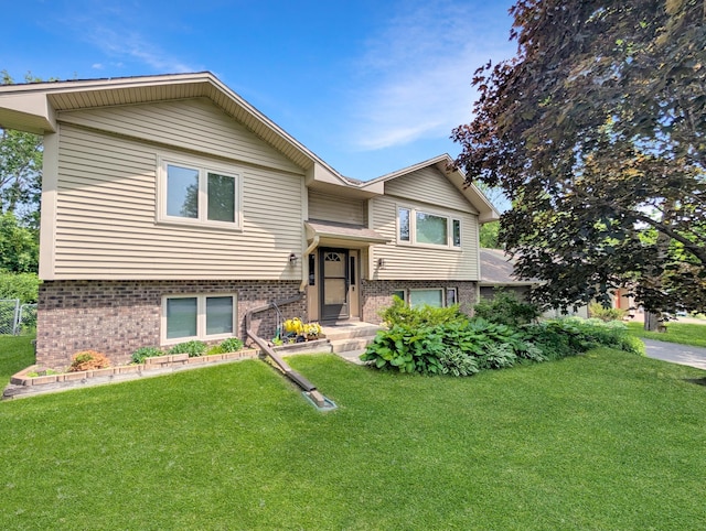 15142 75th Ave N, Maple Grove, MN 55311 - raised ranch with brick siding and a front yard
