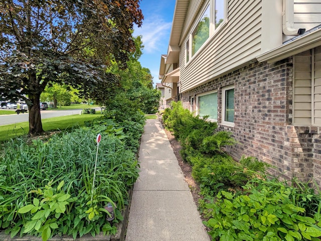 15142 75th Ave N, Maple Grove, MN 55311 - view of home's exterior with brick siding