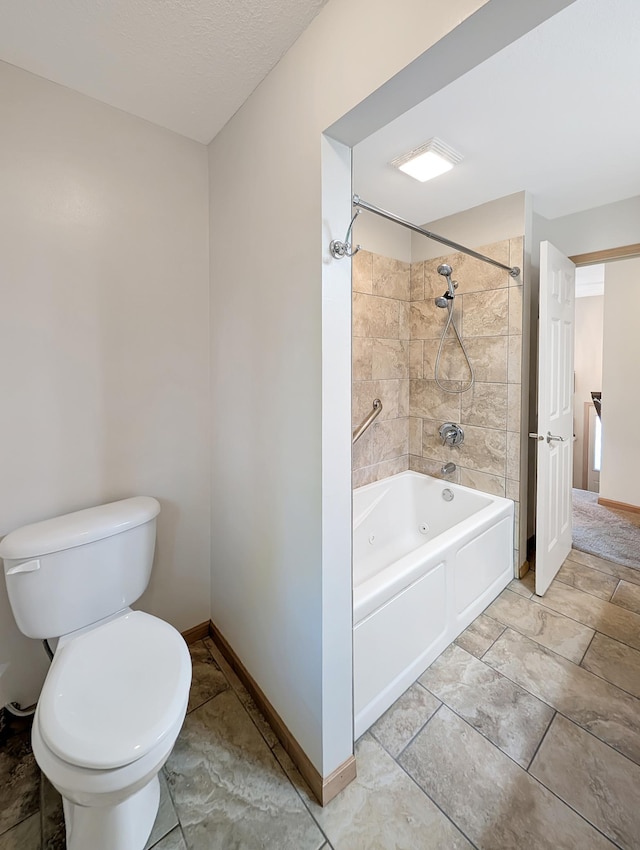 15142 75th Ave N, Maple Grove, MN 55311 - bathroom featuring toilet, baseboards, and washtub / shower combination