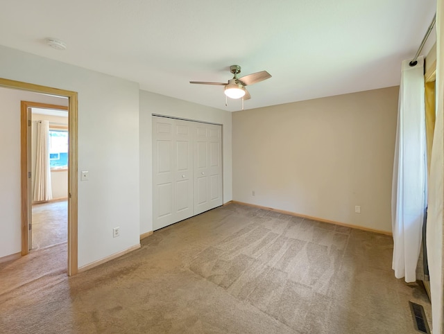 15142 75th Ave N, Maple Grove, MN 55311 - unfurnished bedroom featuring light colored carpet, baseboards, and a closet