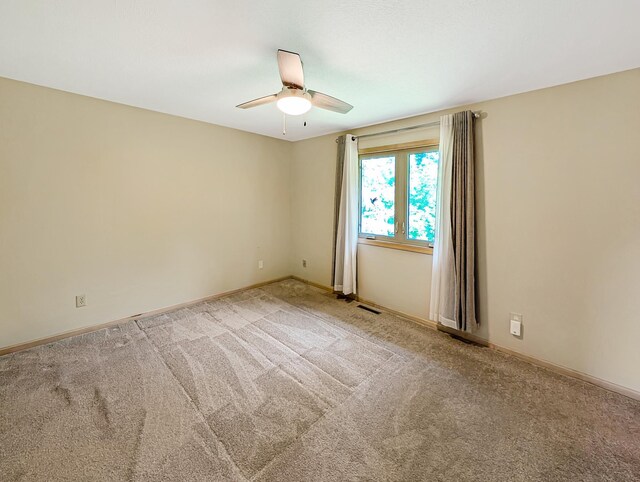 15142 75th Ave N, Maple Grove, MN 55311 - carpeted spare room with a ceiling fan and baseboards