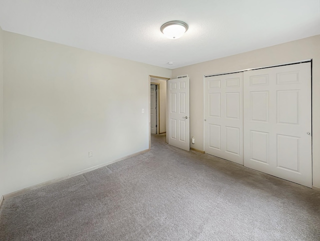 15142 75th Ave N, Maple Grove, MN 55311 - unfurnished bedroom featuring carpet floors, baseboards, and a closet