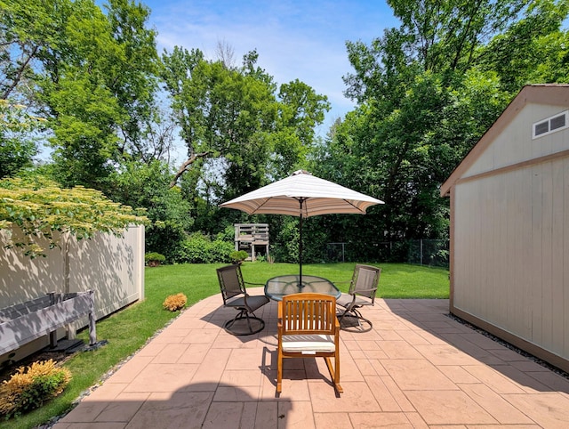 15142 75th Ave N, Maple Grove, MN 55311 - view of patio / terrace featuring outdoor dining area and view of wooded area