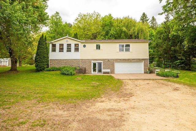 S363 Nicholes Rd, Naples Twp, WI 54755 - view of front of property with dirt driveway, an attached garage, and a front yard