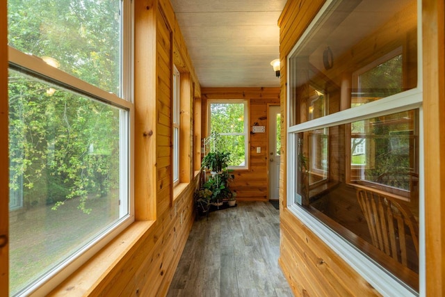 S363 Nicholes Rd, Naples Twp, WI 54755 - sunroom / solarium with wood finished floors and wood walls