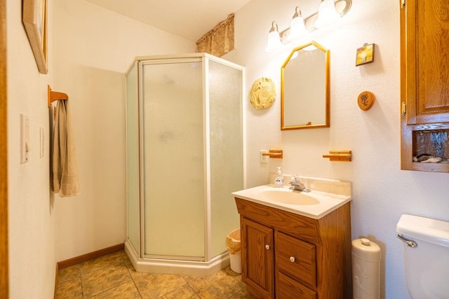 S363 Nicholes Rd, Naples Twp, WI 54755 - bathroom with a shower stall, vanity, toilet, and tile patterned flooring