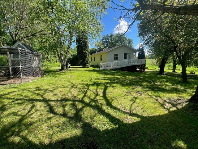 S363 Nicholes Rd, Naples Twp, WI 54755 - view of grassy yard with a wooden deck