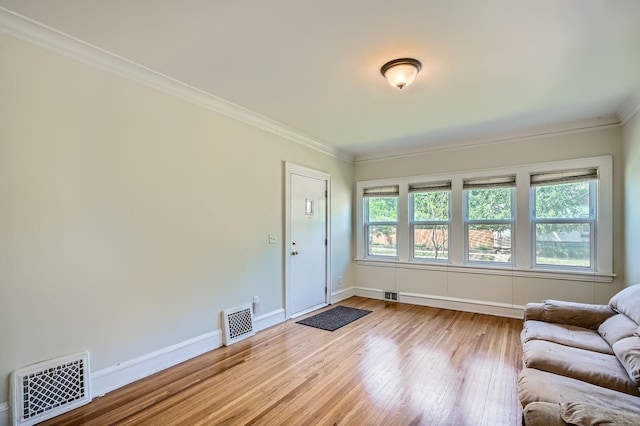 2653 Pierce St NE, Minneapolis, MN 55418 - living room with wood finished floors, ornamental molding, and baseboards
