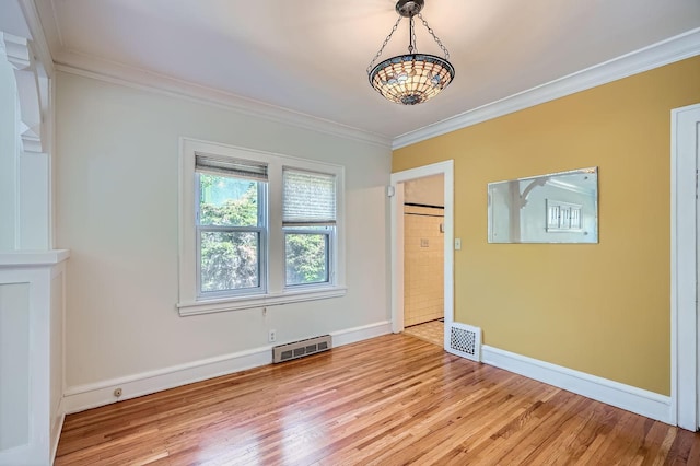 2653 Pierce St NE, Minneapolis, MN 55418 - unfurnished bedroom with ornamental molding, light wood-style floors, baseboards, and a chandelier