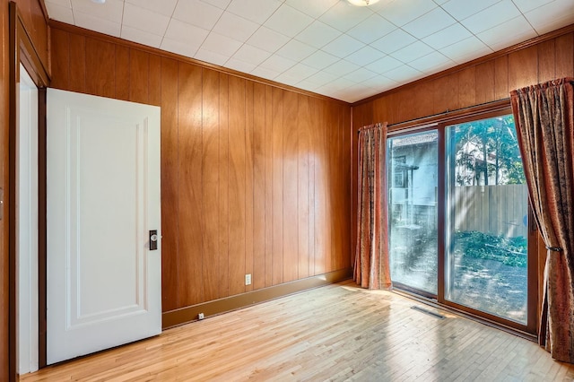 2653 Pierce St NE, Minneapolis, MN 55418 - empty room featuring wood walls and wood finished floors