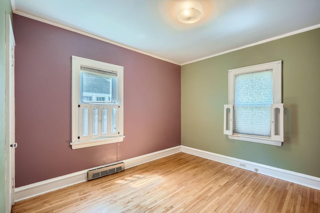 2653 Pierce St NE, Minneapolis, MN 55418 - empty room with crown molding, wood finished floors, and baseboards