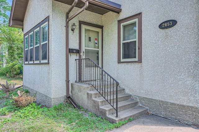 2653 Pierce St NE, Minneapolis, MN 55418 - doorway to property with stucco siding