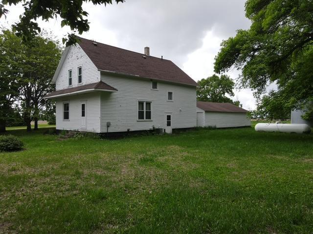 77729 330th St, Prior Twp, MN 56278 - rear view of property featuring a yard