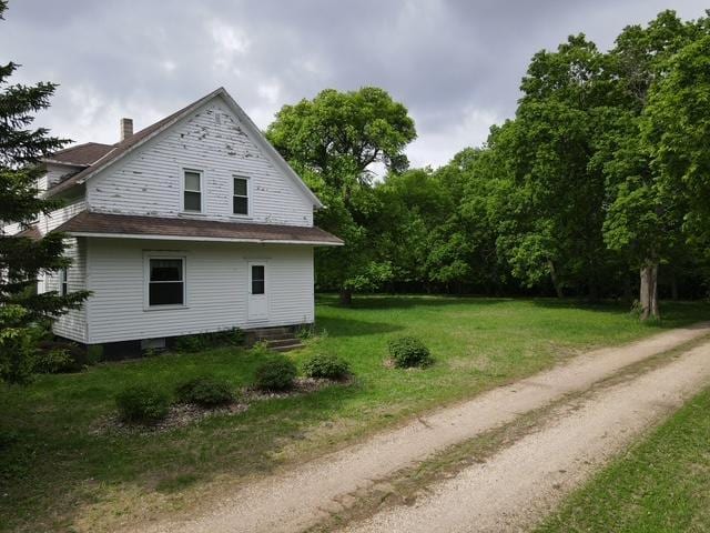 77729 330th St, Prior Twp, MN 56278 - view of home's exterior with a yard