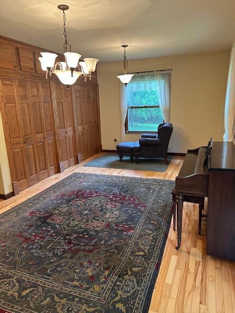 77729 330th St, Prior Twp, MN 56278 - dining space featuring a chandelier and light wood-style floors