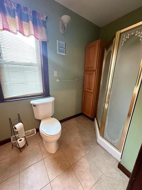 77729 330th St, Prior Twp, MN 56278 - bathroom featuring a shower stall, toilet, tile patterned floors, and baseboards