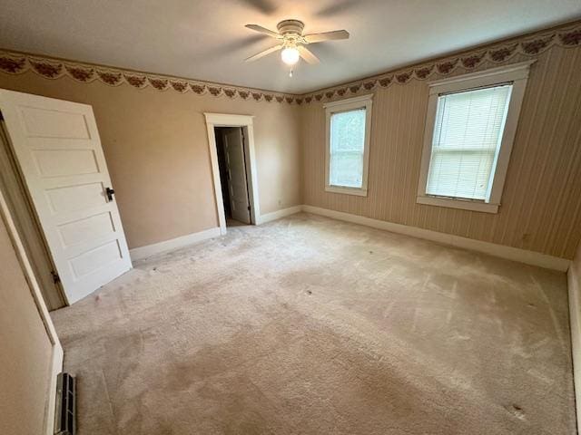 77729 330th St, Prior Twp, MN 56278 - empty room featuring a ceiling fan, baseboards, and light carpet