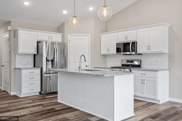 1009 2nd St NW, Delano, MN 55328 - kitchen featuring appliances with stainless steel finishes, a sink, white cabinets, backsplash, and dark wood-style flooring