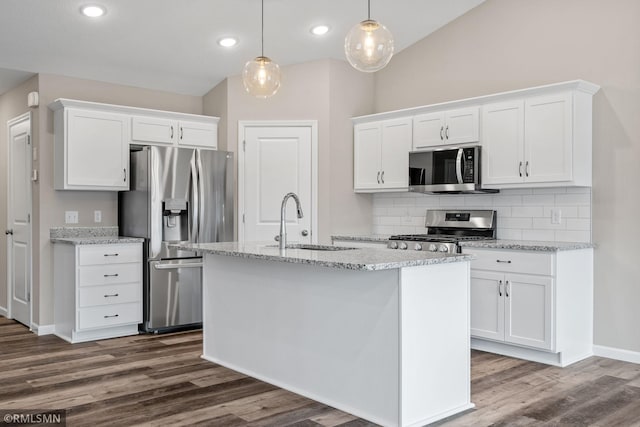 1009 2nd St NW, Delano, MN 55328 - kitchen featuring stainless steel appliances, a sink, white cabinetry, decorative backsplash, and dark wood finished floors