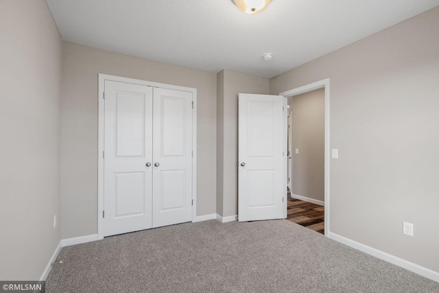 1009 2nd St NW, Delano, MN 55328 - unfurnished bedroom featuring carpet, baseboards, and a closet