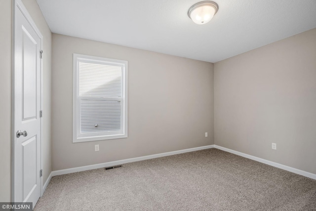 1009 2nd St NW, Delano, MN 55328 - carpeted empty room with baseboards