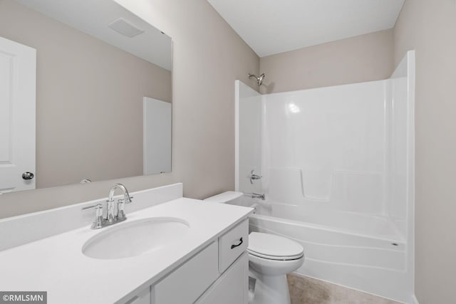 1009 2nd St NW, Delano, MN 55328 - full bathroom with toilet, vanity,  shower combination, and tile patterned floors