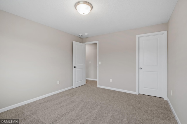 1009 2nd St NW, Delano, MN 55328 - unfurnished bedroom featuring carpet flooring and baseboards