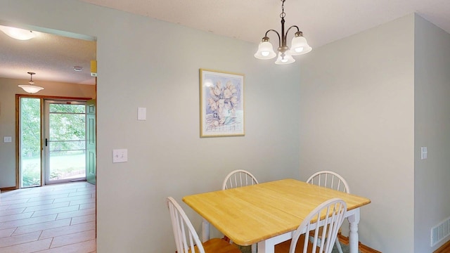 5121 Cameron Dr NW, Cascade Twp, MN 55901 - dining space featuring a chandelier