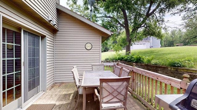 5121 Cameron Dr NW, Cascade Twp, MN 55901 - deck with outdoor dining space and a yard