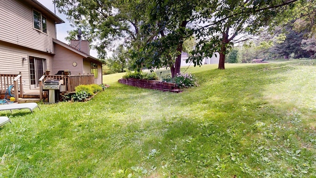 5121 Cameron Dr NW, Cascade Twp, MN 55901 - view of grassy yard featuring a deck