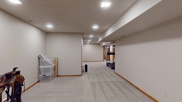 5121 Cameron Dr NW, Cascade Twp, MN 55901 - finished below grade area featuring carpet floors, recessed lighting, and baseboards