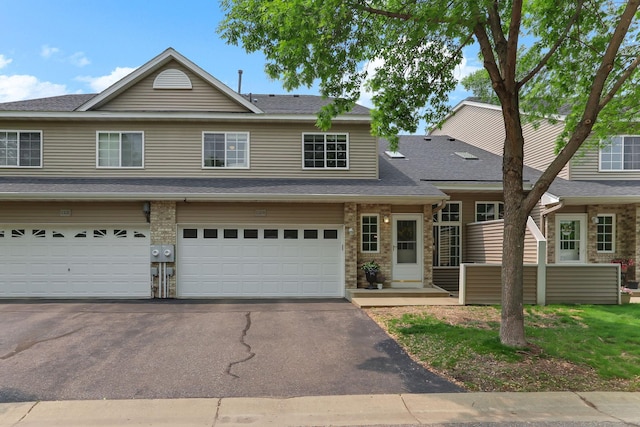 11219 16th St NE, Saint Michael, MN 55376 - view of front of property featuring asphalt driveway, a shingled roof, and a garage